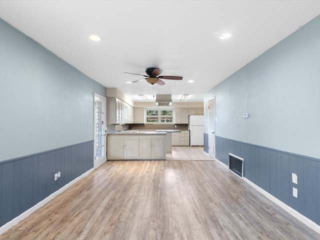 kitchen featuring white refrigerator, ceiling fan, and light hardwood / wood-style flooring