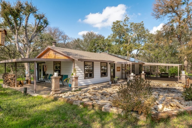 back of house featuring a patio