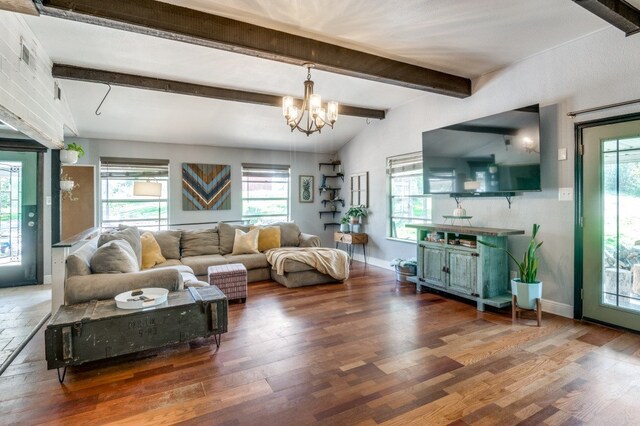 living room with vaulted ceiling with beams, a chandelier, and dark wood-type flooring