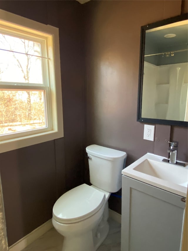 bathroom with a shower, tile patterned flooring, vanity, and toilet