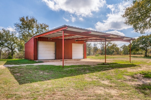 garage featuring a lawn