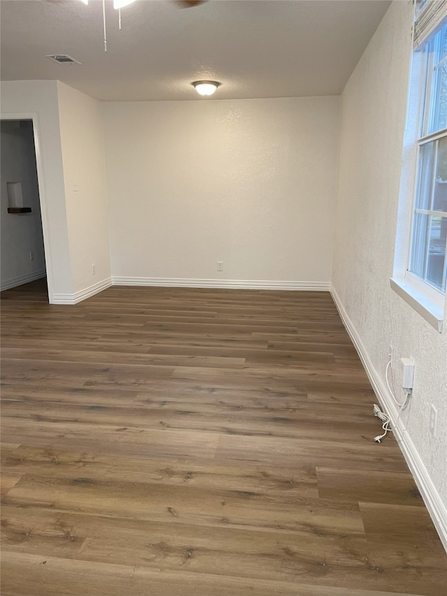 empty room featuring dark hardwood / wood-style floors