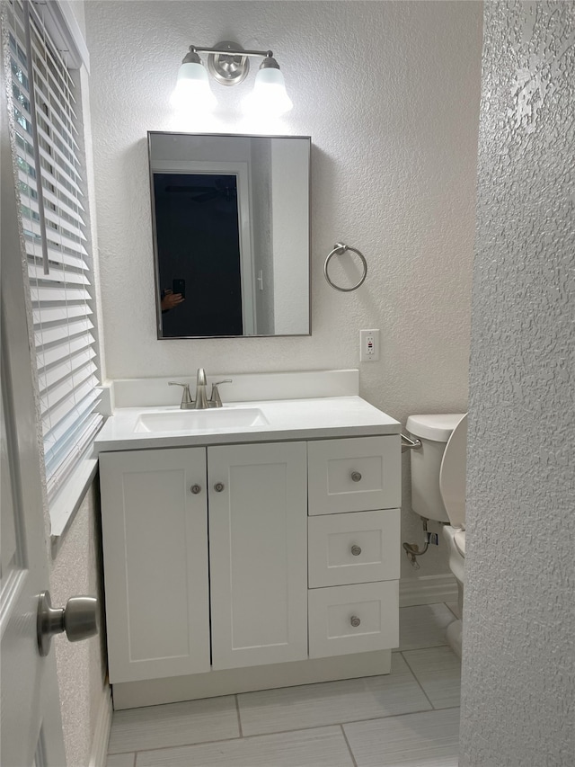 bathroom with vanity and toilet