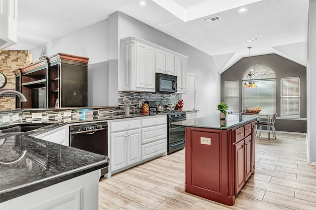 kitchen with white cabinetry, backsplash, black appliances, and vaulted ceiling