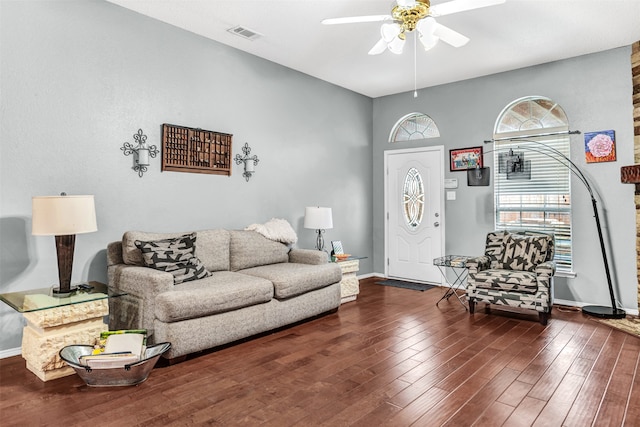 living room featuring dark hardwood / wood-style floors and ceiling fan