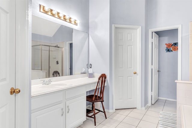 bathroom with vanity, walk in shower, vaulted ceiling, and tile patterned flooring