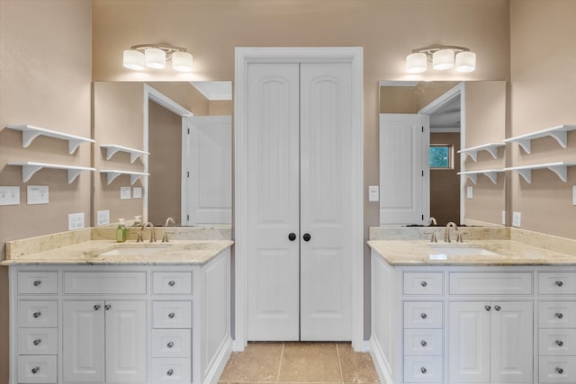 bathroom with vanity, crown molding, and tile patterned floors