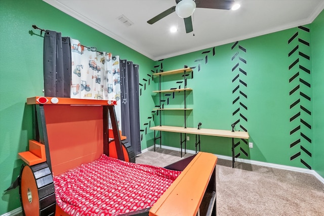 carpeted bedroom featuring ceiling fan and ornamental molding