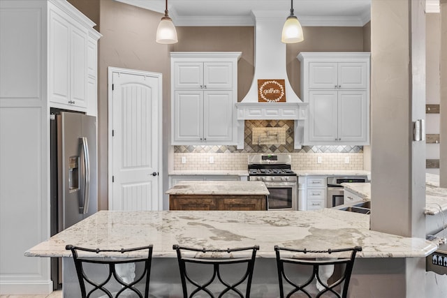 kitchen with stainless steel appliances, light stone countertops, pendant lighting, custom exhaust hood, and white cabinets