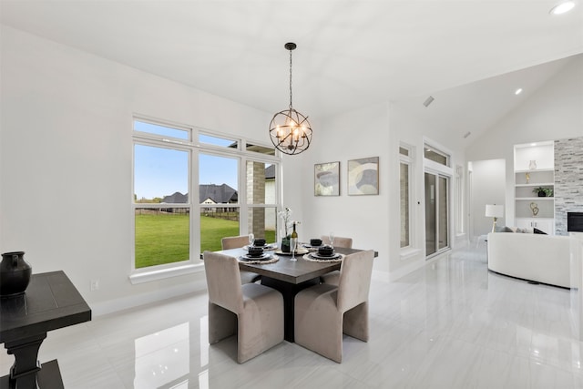 dining area with high vaulted ceiling, a fireplace, baseboards, built in features, and an inviting chandelier