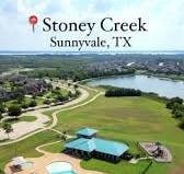 aerial view featuring view of golf course and a water view