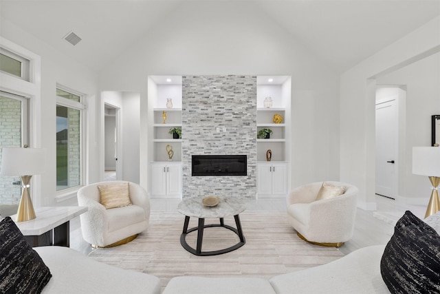 389 Arbor Mill Ct, Sunnyvale, TX 75182 - living room featuring built in shelves, a fireplace, high vaulted ceiling, baseboards, and light wood-style floors
