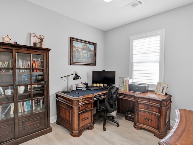 office with light hardwood / wood-style floors