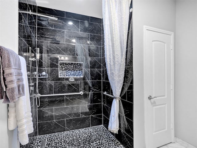 bathroom with a shower with shower curtain