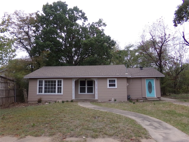 ranch-style house with a front lawn