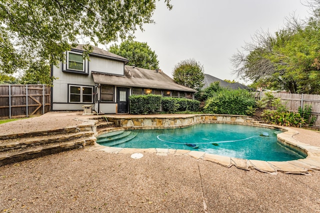 view of swimming pool with a patio area