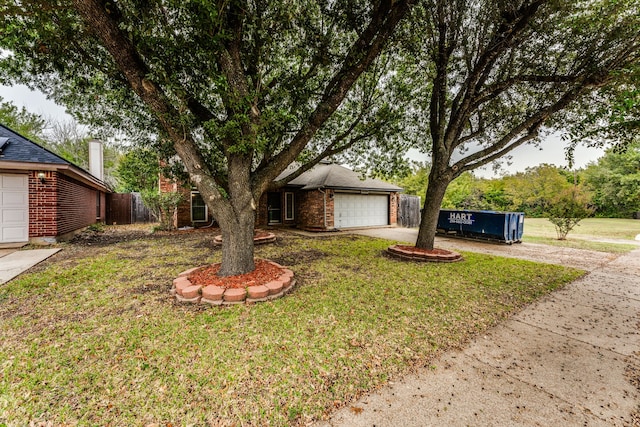 ranch-style home featuring a front yard and a garage