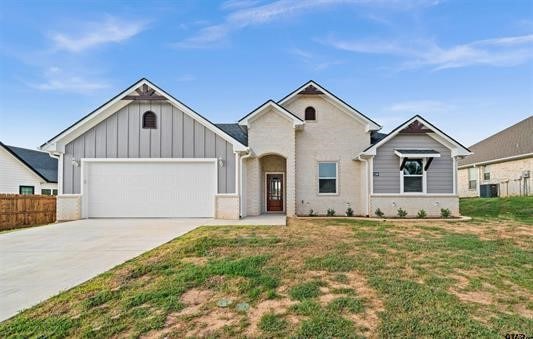 view of front of property with a front lawn and a garage