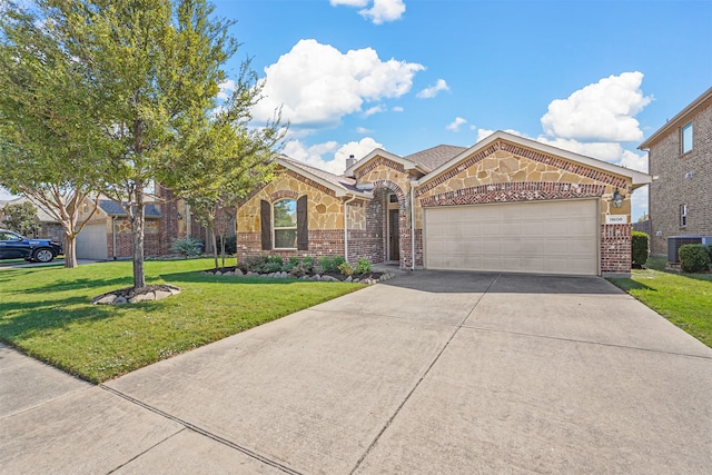 view of front of property featuring a front yard, cooling unit, and a garage