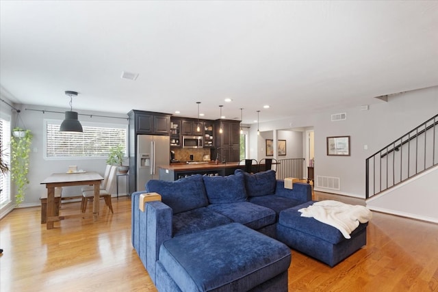 living room with light hardwood / wood-style flooring