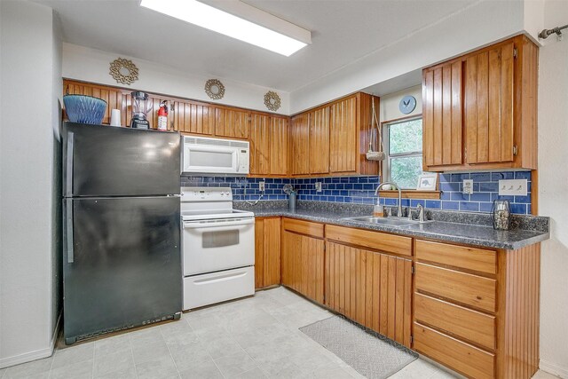 kitchen featuring a notable chandelier, tasteful backsplash, sink, and a textured ceiling