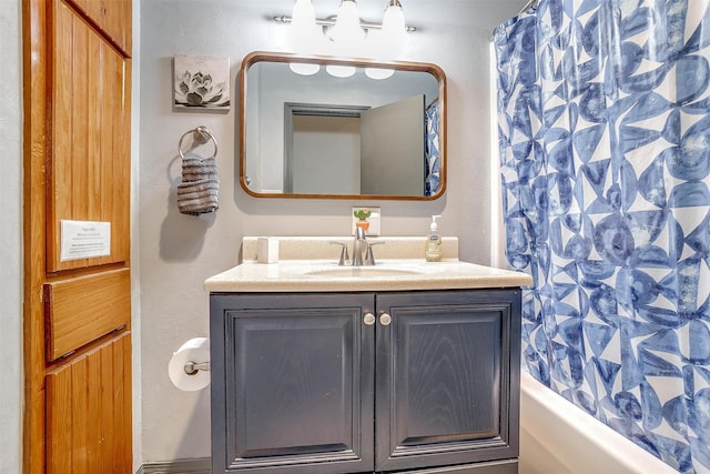 bathroom with vanity and shower / bath combination with curtain