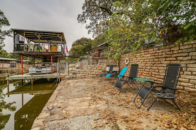 dock area with a water view