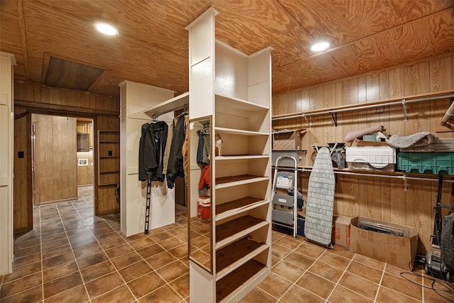 walk in closet with tile patterned flooring