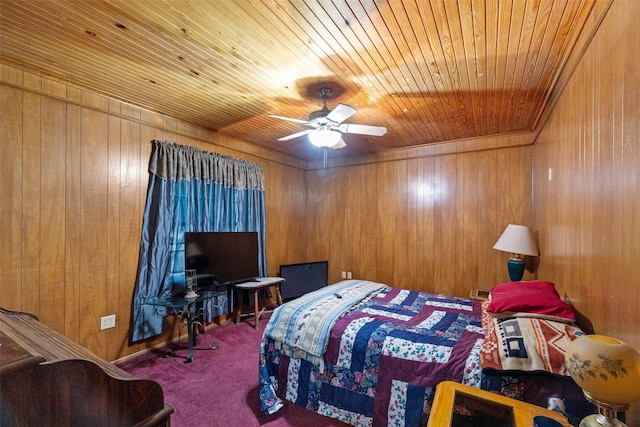 carpeted bedroom featuring wooden walls, wooden ceiling, and ceiling fan