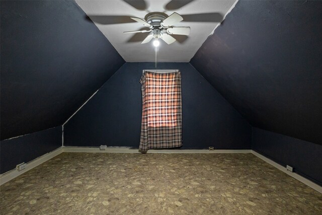 additional living space featuring vaulted ceiling and ceiling fan