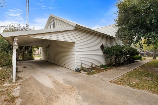 view of property exterior with a carport