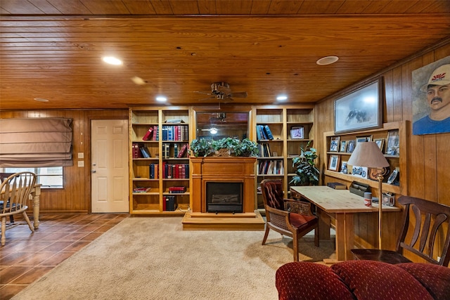 tiled office space with wood walls, wooden ceiling, and ceiling fan