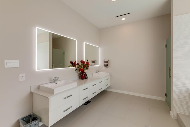 bathroom featuring tile patterned flooring and vanity