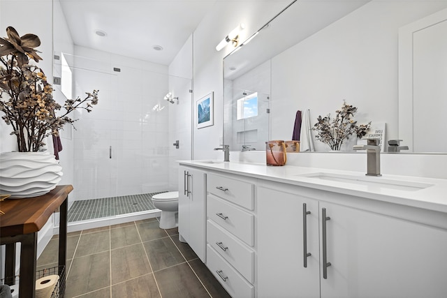 bathroom with vanity, toilet, and an enclosed shower