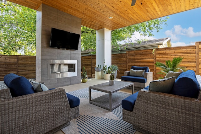 view of patio / terrace featuring an outdoor living space with a fireplace