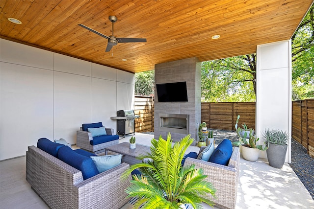 view of patio featuring an outdoor living space with a fireplace, a grill, and ceiling fan