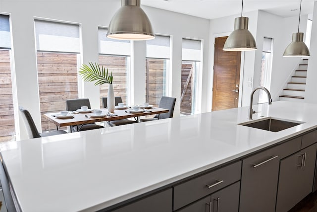 kitchen featuring sink and decorative light fixtures