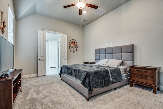 bedroom featuring lofted ceiling, light carpet, and ceiling fan