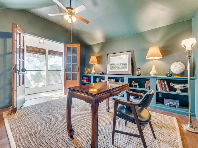 office with french doors, ceiling fan, lofted ceiling, and light wood-type flooring