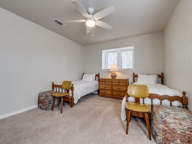 bedroom with light carpet and ceiling fan