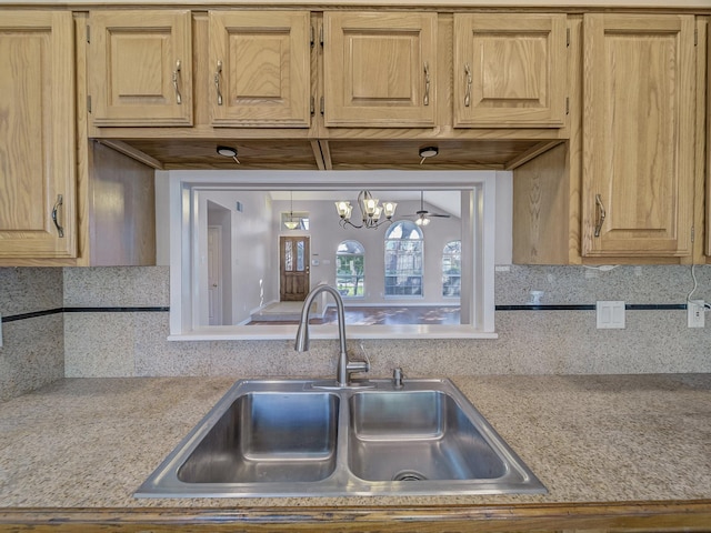 kitchen featuring tasteful backsplash and sink