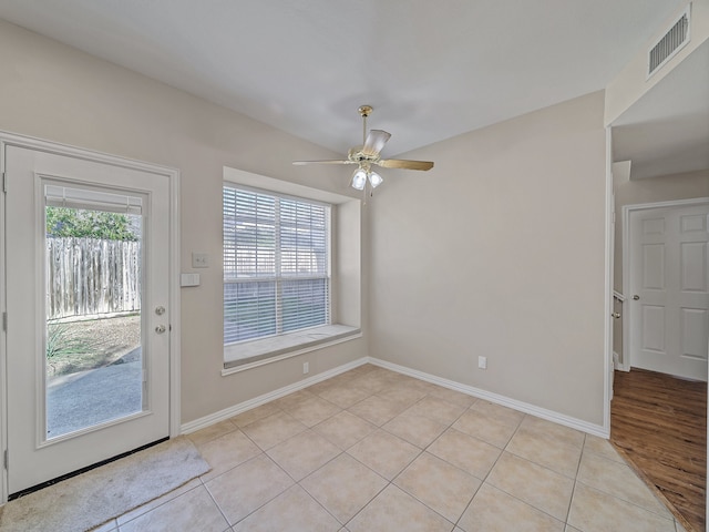 interior space featuring a healthy amount of sunlight and ceiling fan