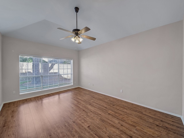 empty room featuring hardwood / wood-style floors and ceiling fan