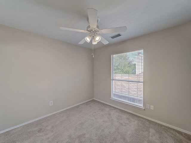 empty room with light carpet and ceiling fan