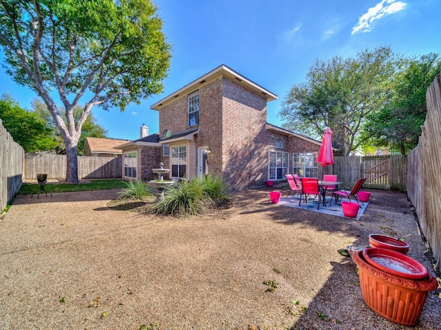 rear view of property with a patio area