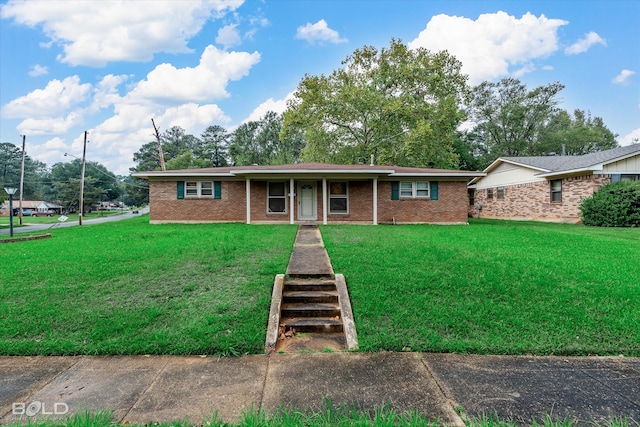 ranch-style house with a front lawn