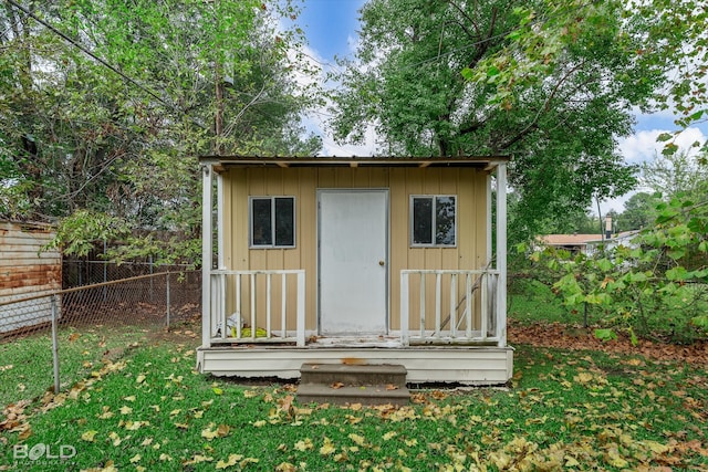 view of outbuilding with a lawn