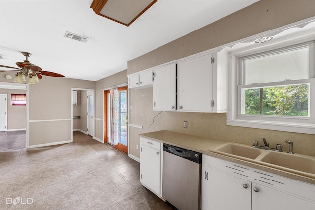 kitchen with dishwasher, sink, backsplash, white cabinets, and ceiling fan