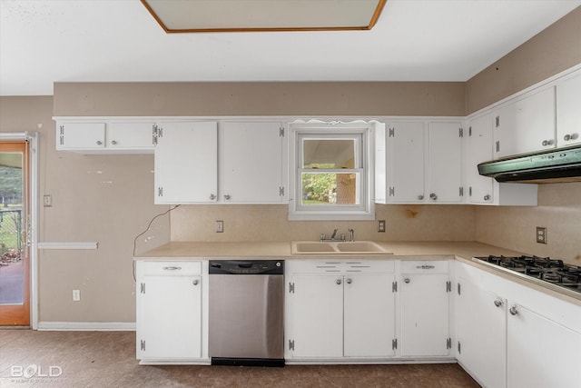 kitchen with tasteful backsplash, appliances with stainless steel finishes, sink, and white cabinets