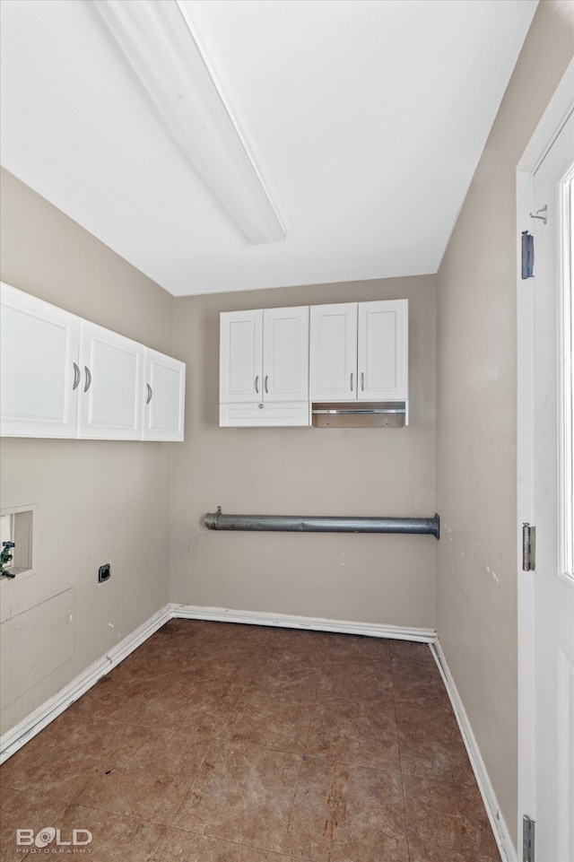 laundry room featuring cabinets, washer hookup, tile patterned flooring, and electric dryer hookup